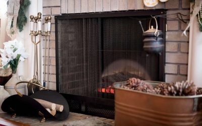 Cozy fireplace with a burning wood log, highlighting the importance of fire safety and proper fireplace maintenance