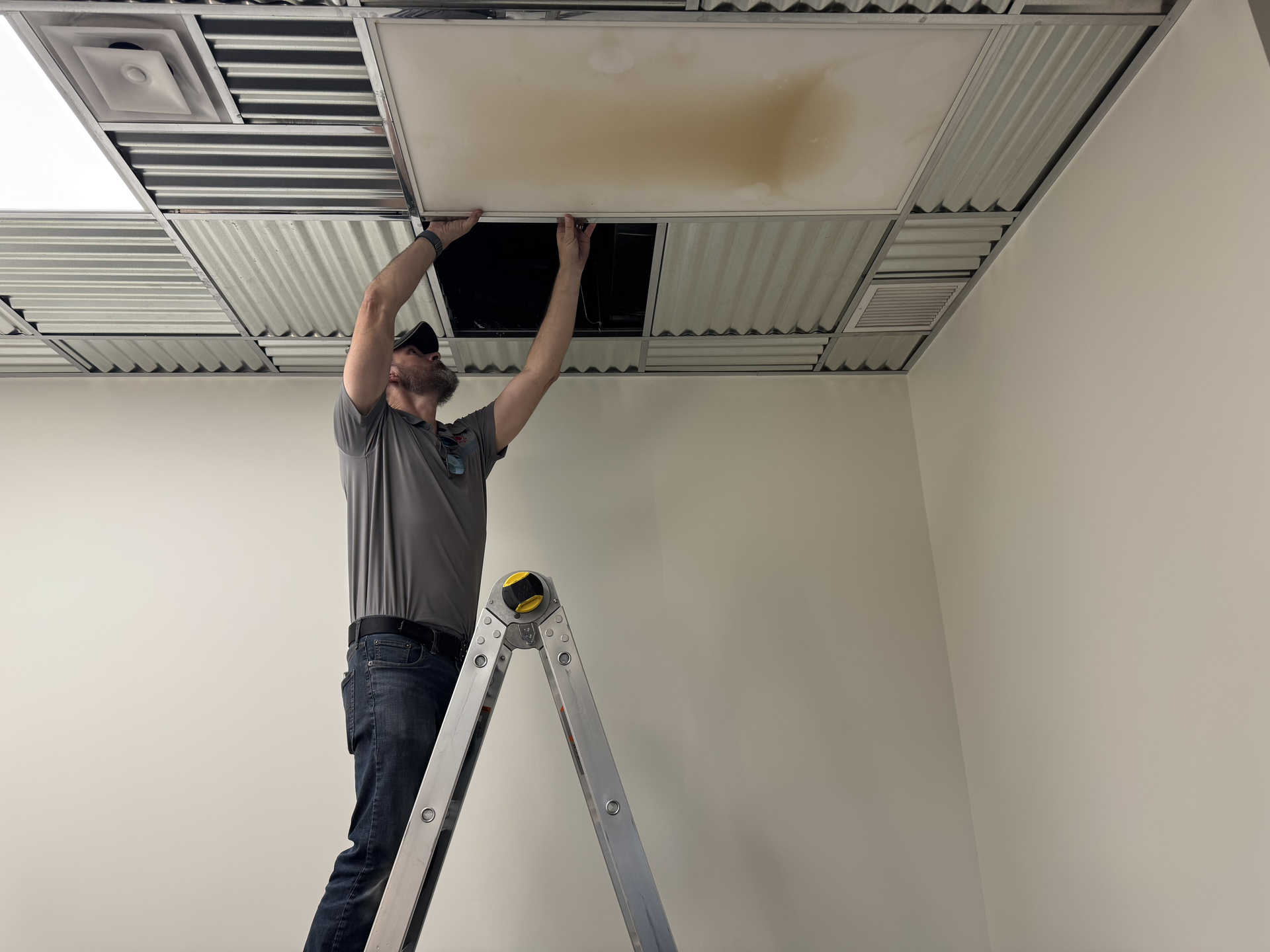 Kelcey and his partner — founders of Unified Restoration — with their equipment at a commercial property in Mesa, Arizona