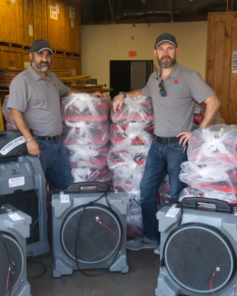 Unified Restoration LLC founders with restoration equipment in Chandler Arizona local family owned company