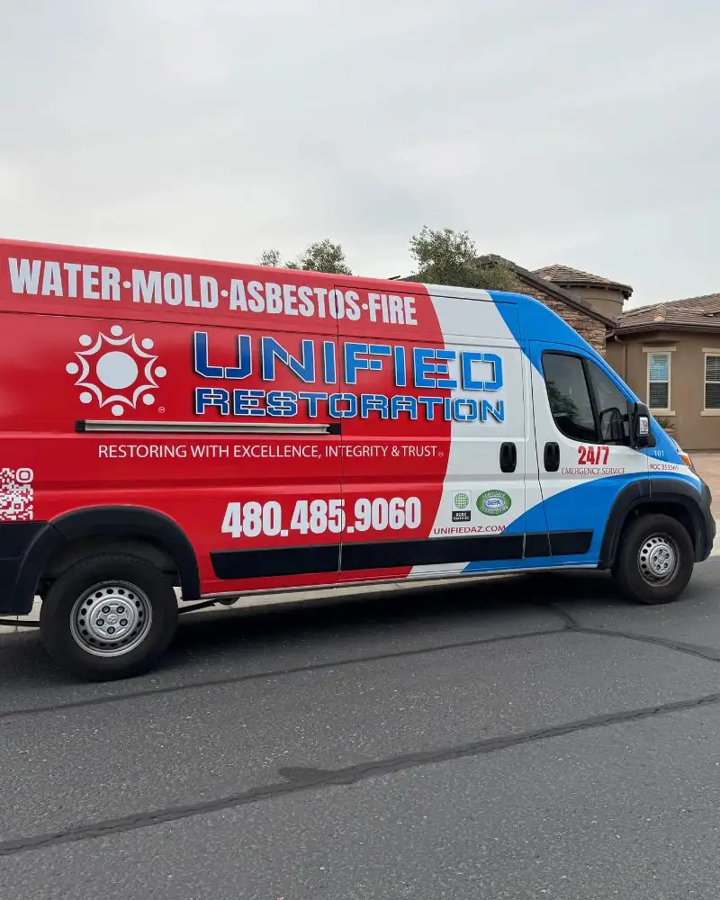 Unified Restoration LLC service van parked at a Mesa Arizona home — water damage restoration response