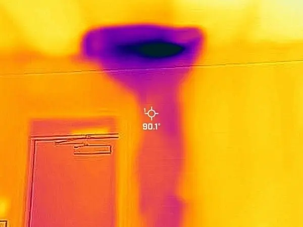 Thermal infrared camera image showing hidden moisture intrusion in a Goodyear, Arizona garage ceiling and wall detected by Unified Restoration LLC during a real job assessment